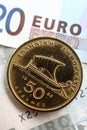 Greek drachma on euros vertical Royalty Free Stock Photo