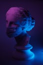 Dark and conceptual image of a female bust in greek style with mask Royalty Free Stock Photo