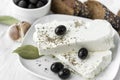 Greek feta cheese with olives, spices, garlic, bread