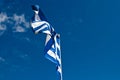 Blue and white Greek flag against blue sky, holida Royalty Free Stock Photo