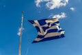 Greek flag against blue sky Royalty Free Stock Photo