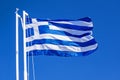 Greek Flag Against Blue Sky Royalty Free Stock Photo