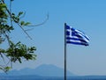 Greek Flag Against Blue Sky Royalty Free Stock Photo