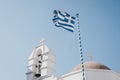 Greek flag against blur sky over the orthodox chapel Royalty Free Stock Photo