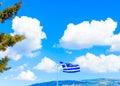 Greek flag against Greek sky Royalty Free Stock Photo