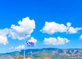 Greek flag against Greek sky Royalty Free Stock Photo