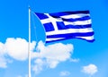 Greek flag against Greek sky Royalty Free Stock Photo