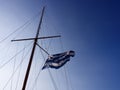 Greek flag floating in a sailing boat