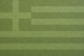 Greek flag outline on green cardboard surface. Paper texture with cellulose fibers. Olive paperboard wallpaper or background. Royalty Free Stock Photo