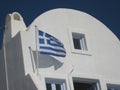 Greek flag proudly waving in the Santorini breeze Royalty Free Stock Photo