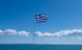 Greek flag waving against clear blue sky background Royalty Free Stock Photo