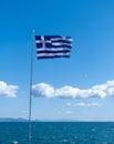 Greek flag waving against clear blue sky background Royalty Free Stock Photo