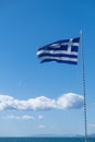 Greek flag waving against clear blue sky background Royalty Free Stock Photo