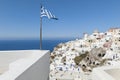 Greek Flag waving in Oia Santorini Royalty Free Stock Photo