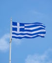 Greek flag waving against blue sky background Royalty Free Stock Photo