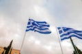 Greek flag waving on a flag pole against the sky Royalty Free Stock Photo