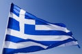 Greek flag waving under blue sky Royalty Free Stock Photo