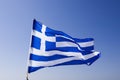 Greek flag waving under blue sky Royalty Free Stock Photo
