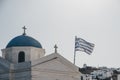 Greek flag in the wind on the orthodox church in Mykonos, Greece Royalty Free Stock Photo