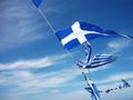 Greek flags flying in the wind Royalty Free Stock Photo