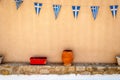 Greek flags on wall with poteries - Hraion