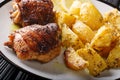 Greek food chicken thighs grilled with fried lemon garlic oregano potatoes closeup. horizontal Royalty Free Stock Photo