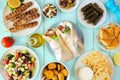 Greek food table scene, top view on a blue wood background Royalty Free Stock Photo