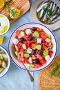 Greek food table scene, top view . Variety of items including greece salad, cucumber dip Tzatziki, Anchovy fillets, lemon potatoes Royalty Free Stock Photo