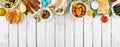Greek food top border, overhead view on a white wood banner background Royalty Free Stock Photo