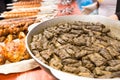 Greek Grape Leaf Rolls on Table with Grilled Meats