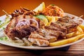 Greek grill plate with souvlaki and souzuki steak Royalty Free Stock Photo