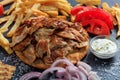 Greek gyros dish on a black dish