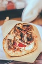 Greek gyros pita with chopped meat, onion and tzatziki sauce Royalty Free Stock Photo