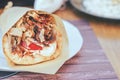 Greek gyros pita with chopped meat, onion and tzatziki sauce Royalty Free Stock Photo