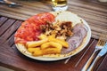 Greek gyros with tzaziki and fries Royalty Free Stock Photo