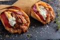Greek gyros wrapped in pita breads on a black dish Royalty Free Stock Photo