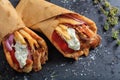 Greek gyros wrapped in pita breads on a black dish Royalty Free Stock Photo