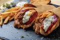 Greek gyros wrapped in pita breads on a black dish Royalty Free Stock Photo