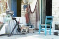 Greek house with fishing gear and chair