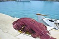 Greek island fishing nets and a boat Royalty Free Stock Photo