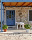 Greek island house entrance with blue door Royalty Free Stock Photo