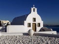 Greek Islands Style Beautiful White Church against Sunny Blue Sky, Oia Village, Santorini Island, Greece