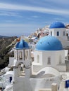 Greek Islands traditional white and blue churches at Oia village on Santorini island Royalty Free Stock Photo