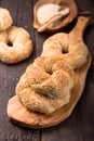 Greek koulouri or Turkish bagels called Simit in stack. Traditional street food, crispy sesame bread ring bagels Royalty Free Stock Photo