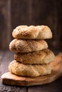 Greek koulouri or Turkish bagels called Simit in stack. Traditional street food, crispy sesame bread ring bagels