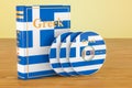 Greek language textbook with flag of Greece and CD discs on the