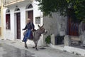 Greek man on donkey in the picturesque town of Plomari