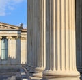 Greek marble pillars infront of a classical building Royalty Free Stock Photo