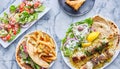 Greek meal with chicken souvlaki platter, gryos, french fries, salad and baklava Royalty Free Stock Photo