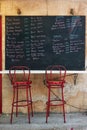 Greek menu with price on chalkboard at street cafe Royalty Free Stock Photo